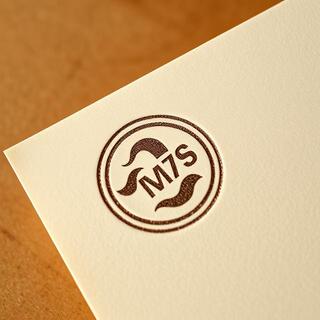 Embossed stamp on paper corner