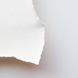 Deckle paper edge near a thin frame