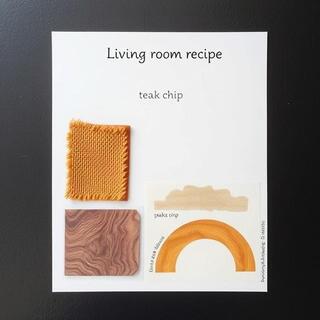 Living room with ochre rug and three framed posters