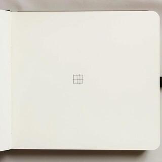 Tiny graphite grid in a notebook margin